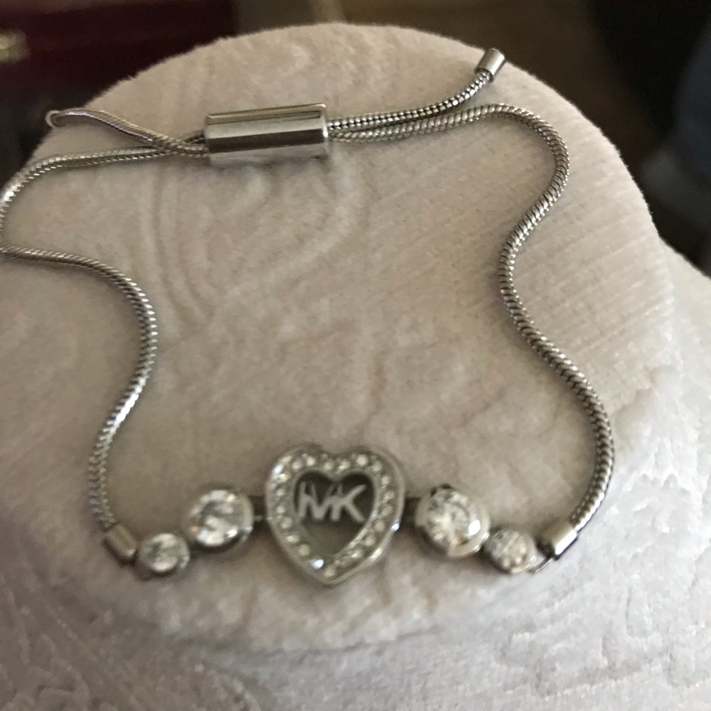 Silver Michael Kors bracket. Adjustable.